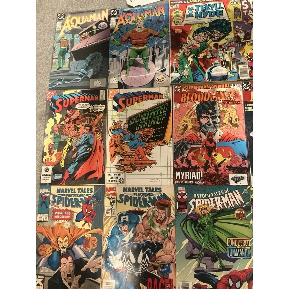Vintage 15 lot of superhero comic books from both DC and Marvel publishers.